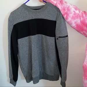 men's black and gray crewneck with zipper detail.